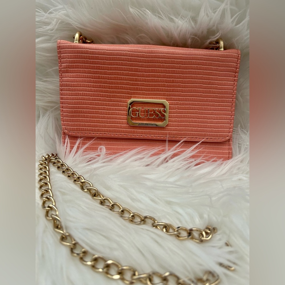 Guess brand small peach bag, in excellent condition.